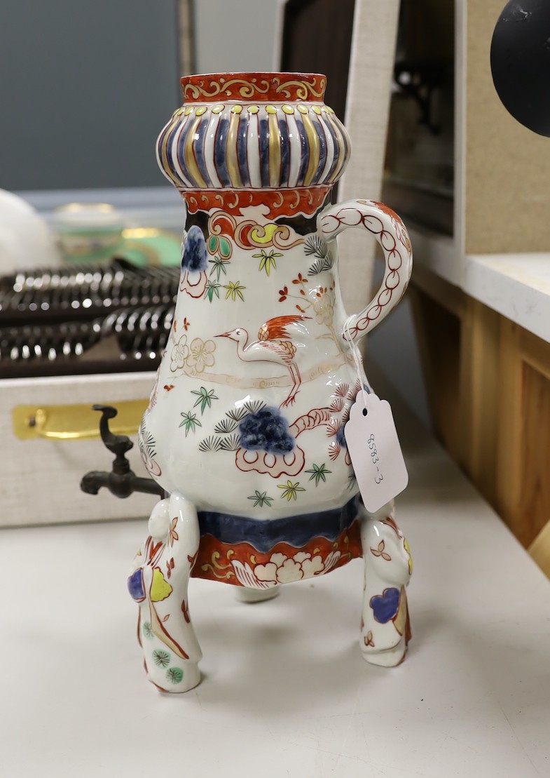 A Japanese Arita or Imari porcelain tripod urn